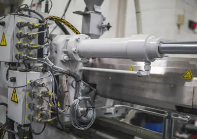 The wiring at the back of the 350 Ton Wittmann Battenfeld equipment, used for plastic injection molding.