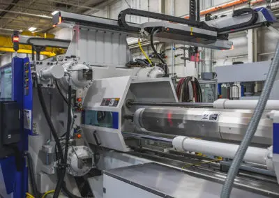 This image shows the 4-axis robot on the top of the 450XL machine.