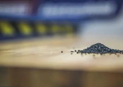 This is an artistic, closeup image of black plastic resin pellets.