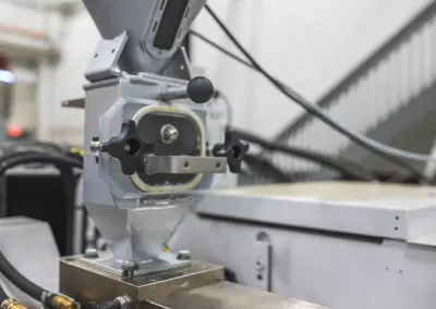 The magnetic component on a hopper, to remove ferrous contaminants like metal shavings for automotive plastic molding projects