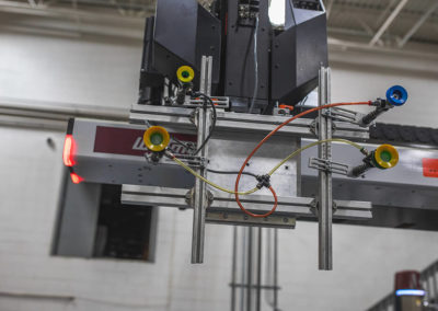 The 4-axis Cartesian robot on the 500 Ton, 450XL Wittmann Battenfeld in Sterling Heights at Plastic Molding Development Company is shown here.