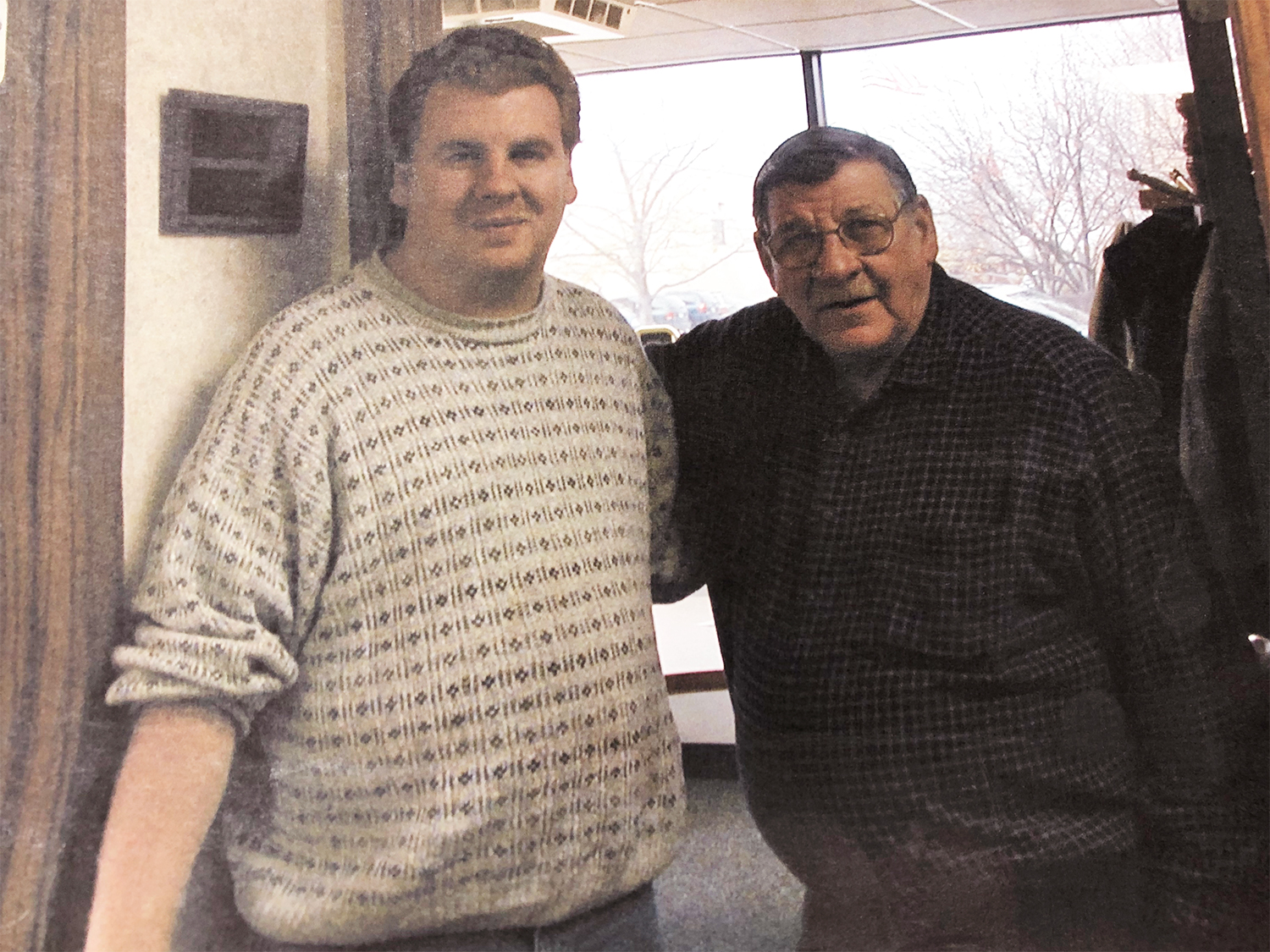History of PMD: Albie Kitts founded the Sterling Heights plastic molding company in 1985. His son, Gary, began working with him when he was 15, and Gary is the president today. This is a rare print photograph taken of the two before Albie's passing.