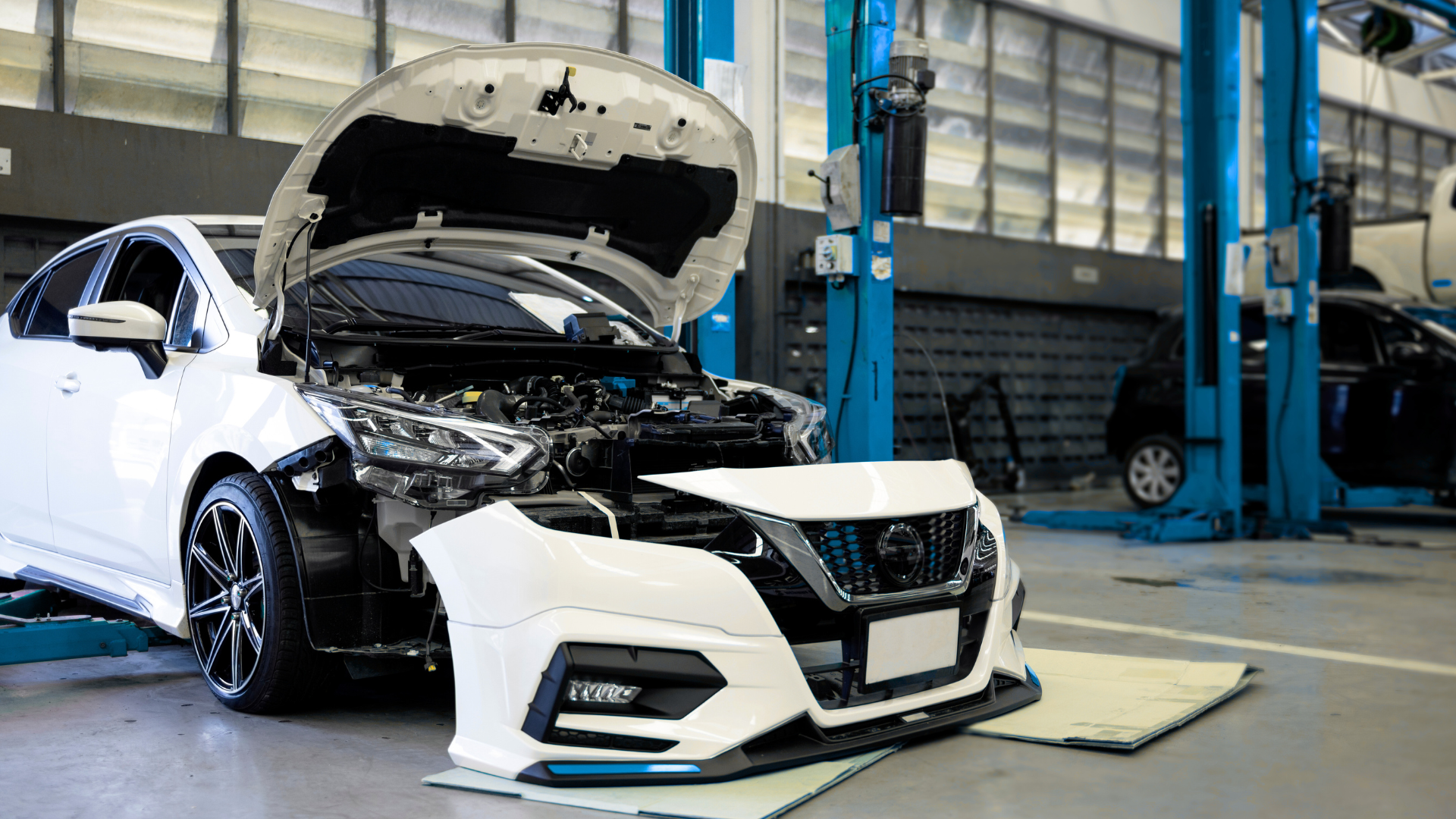 A car being disassembled, showcasing lightweight automotive automotive plastic mold components created through plastic molding manufacturing.
