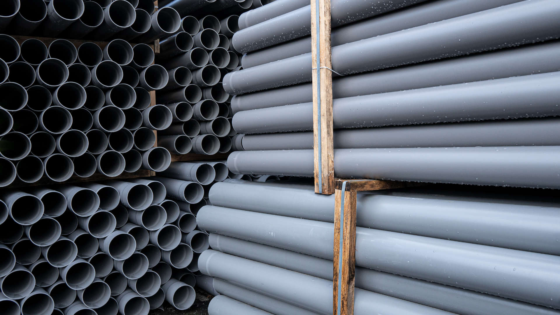 A stack of plastic grey pipes
